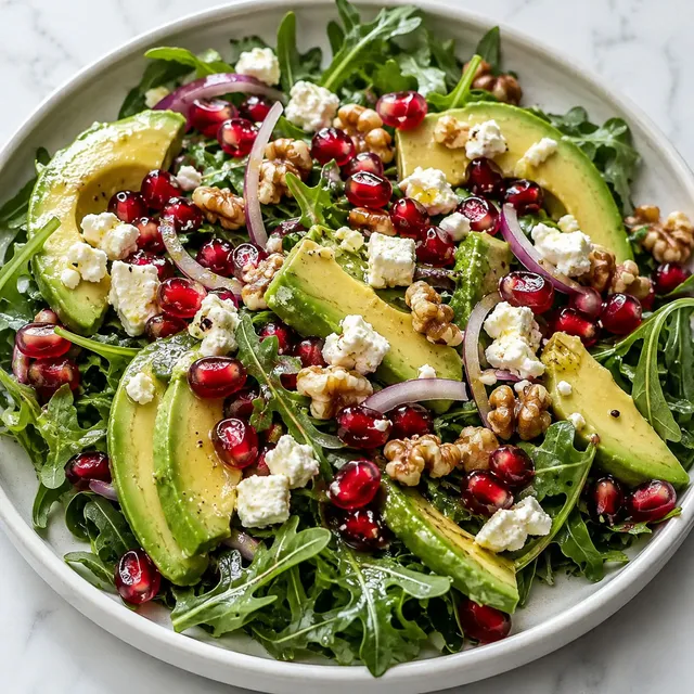 Avocado and pomegranate salad with feta, red onion and toasted walnuts